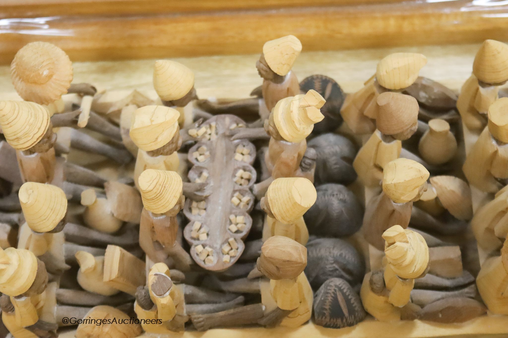 An African wood model of figures in a boat, length 155cm